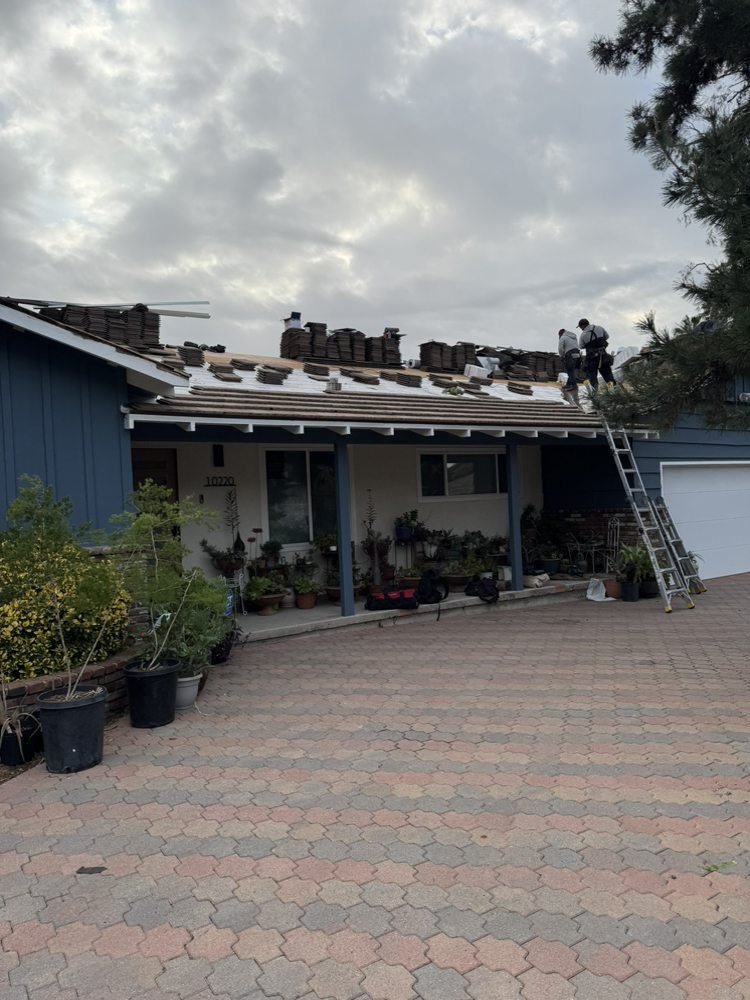Tile re-roof in progress in Northridge by Crown Roofing and Repairs Inc