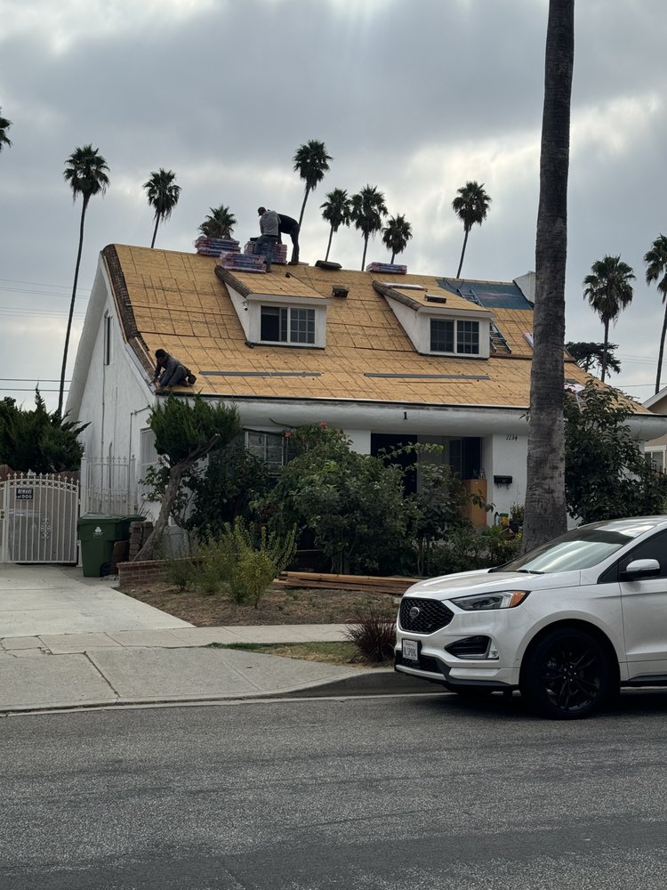 New shingle roof with new wood decking and three skylights by Crown Roofing and Repairs Inc