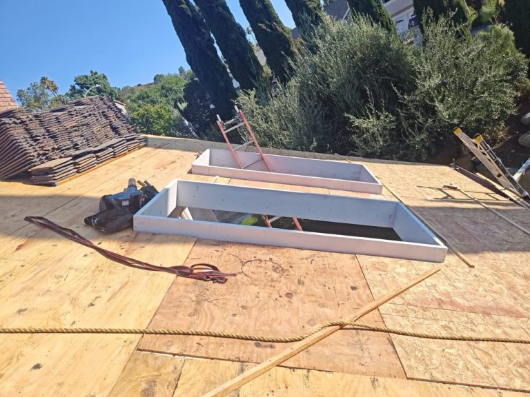 Large skylight installation on a tile roof by Crown Roofing and Repairs Inc